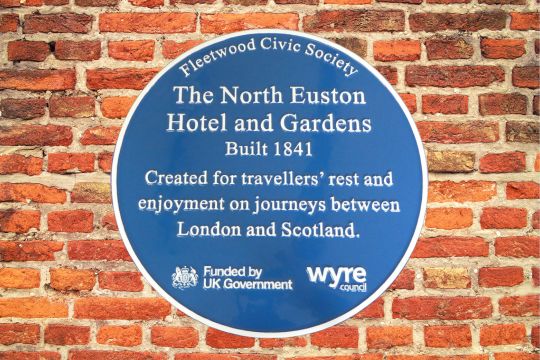 Blue plaque commemerating Fleetwood Civic Society The North Euston Hotel and Gardens Built 1841. Created for travellers' rest and enjoyment on journeys between London and Scotland. Funded by UK Government