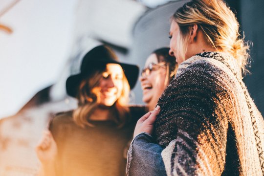 Group of people enjoying themselves, laughing