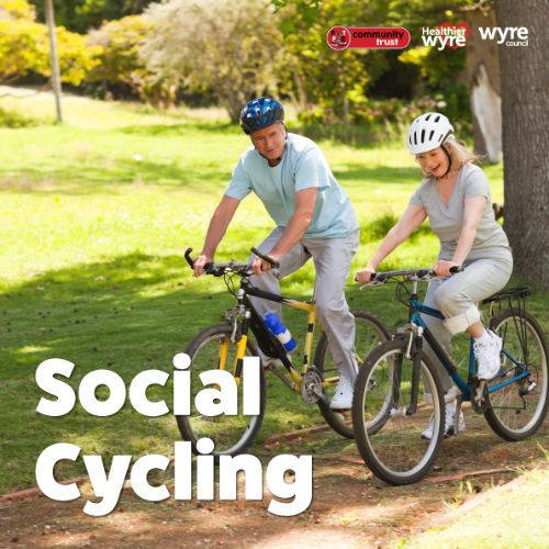 Two adults cycling in a park. Social cycling.